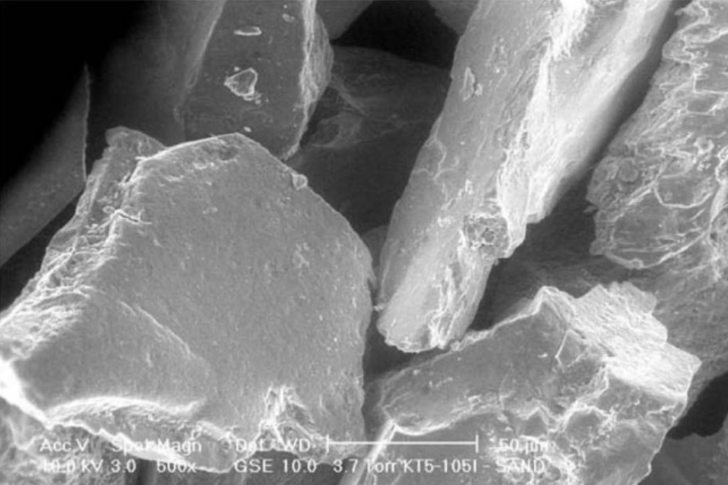 Scanning electron microscope (SEM) image of sand particles without CAC coating